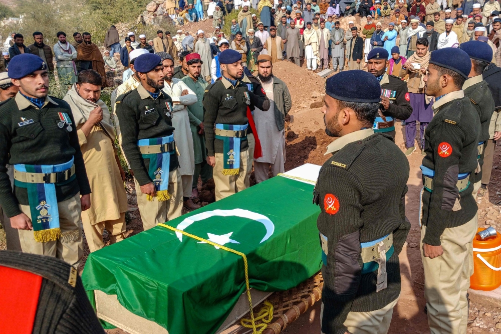 Pakistan's army personnel take part in a funeral ceremony of a soldier killed in an attack in the Makeen area of Khyber Pakhtunkhwa province, in Kohat December 22, 2024. Pakistan air strikes in an eastern border province of Afghanistan killed 46 people, the Taliban government spokesman told AFP today. The strike comes after the Pakistani Taliban — who are known as Tehreek-e-Taliban Pakistan (TTP) and share a common ideology with their Afghan counterparts — last week claimed a raid on an army outpost near the border with Afghanistan, which Pakistani intelligence officials said killed 16 soldiers. — AFP pic