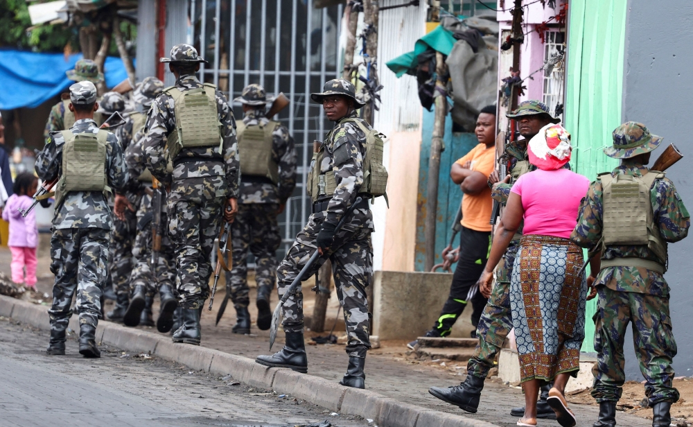A member of the Mozambique military, looks on as they patrol the streets of the capital a day after a ‘national shutdown’ against the election outcome, in Maputo, Mozambique, November 8, 2024. Wisma Putra today said no Malaysians in Mozambique have been affected by the ongoing unrest, which has predominantly impacted urban areas, including the capital Maputo. — Reuters pic 