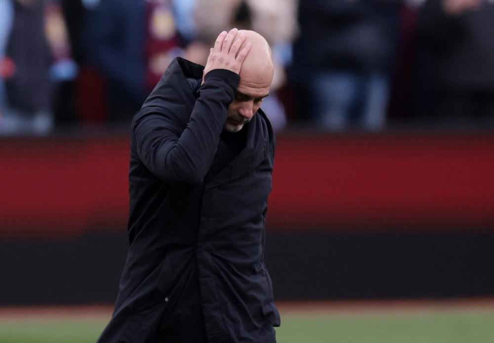 Manchester City manager Pep Guardiola looks dejected after the Premier League match with Aston Villa at Villa Park in Birmingham December 21, 2024. — Reuters pic 