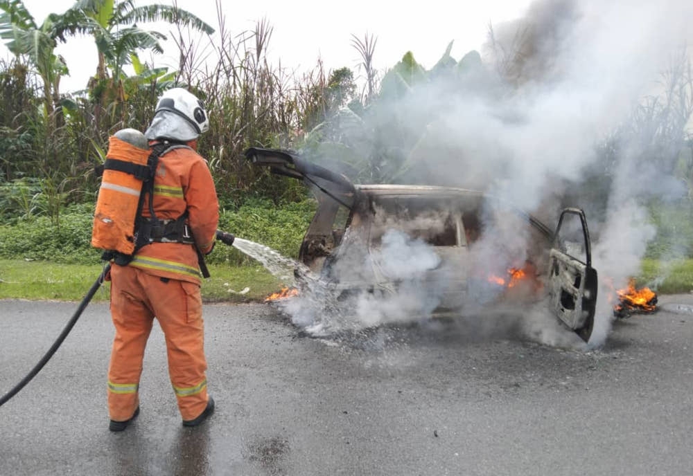 A car was completely destroyed after catching fire at Bandar Baru Permyjaya Tudan near Miri, Sarawak, this morning. — The Borneo Post pic 