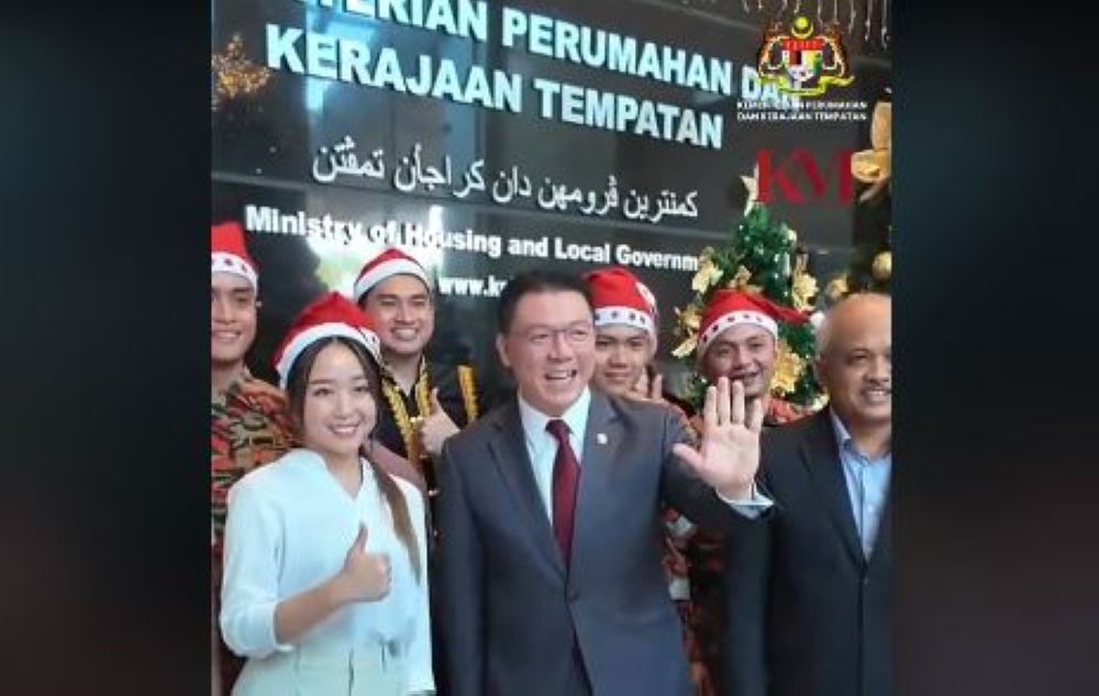 A screenshot of the the viral video of ministry staff singing Christmas songs. — Picture via TikTok/Nga Kor Ming Official