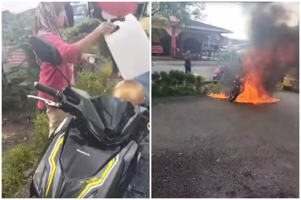 A video circulated widely on social media showed a woman, reportedly a trader, setting a black Honda RSX motorcycle on fire near a stall in Pokok Assam, Taiping.  — Screengrab from Facebook/Aiman Tak Kesah