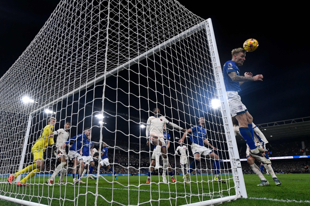 Ipswich Town’s Luke Woolfenden heads the ball away from goal. — AFP