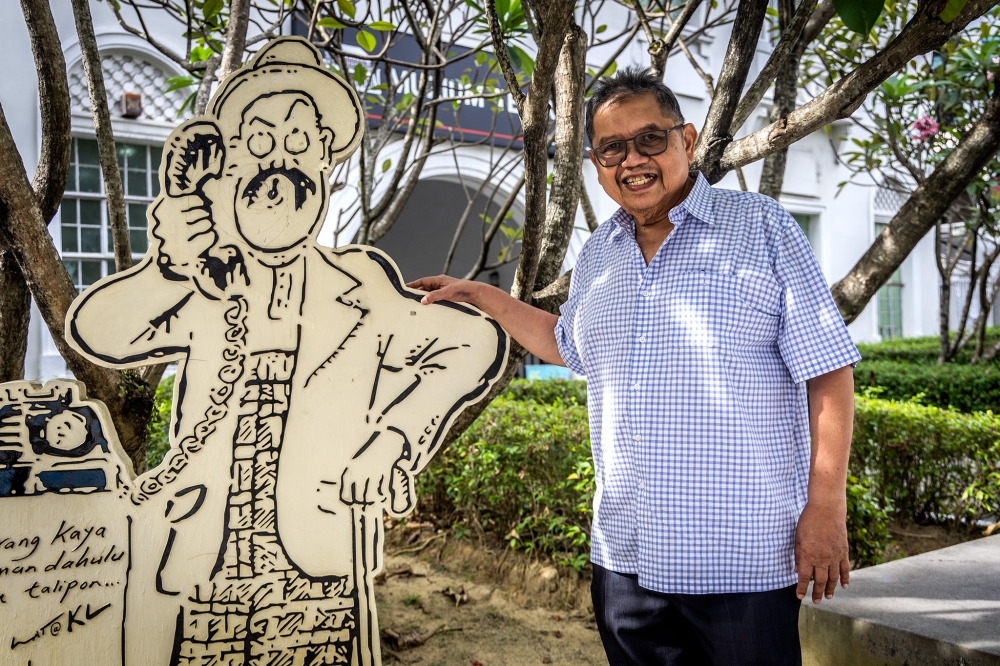 Some of Lat's caricatures can be found scattered around the streets of Kuala Lumpur. — Picture by Firdaus Latif