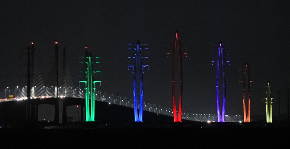 Tenaga Nasional Bhd’s monopole transmission towers are illuminated in vibrant colours in conjunction with the 2025 New Year celebrations on Jan 1, 2025. — Bernama pic