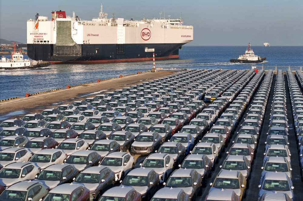 BYD cars are parked at Yantai port in eastern China's Shandong province, waiting to be shipped overseas as surges surged in 2024. — AFP pic