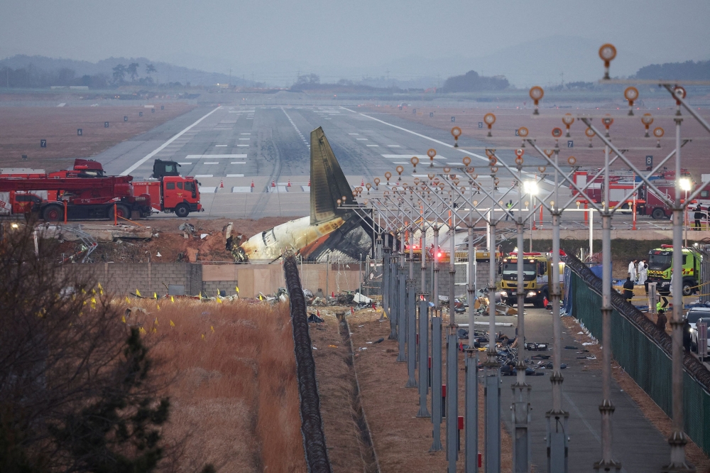 The wreckage of the Jeju Air aircraft that went off the runway and crashed lies at Muan International Airport, in Muan, South Korea, December 30, 2024. — Reuters pic