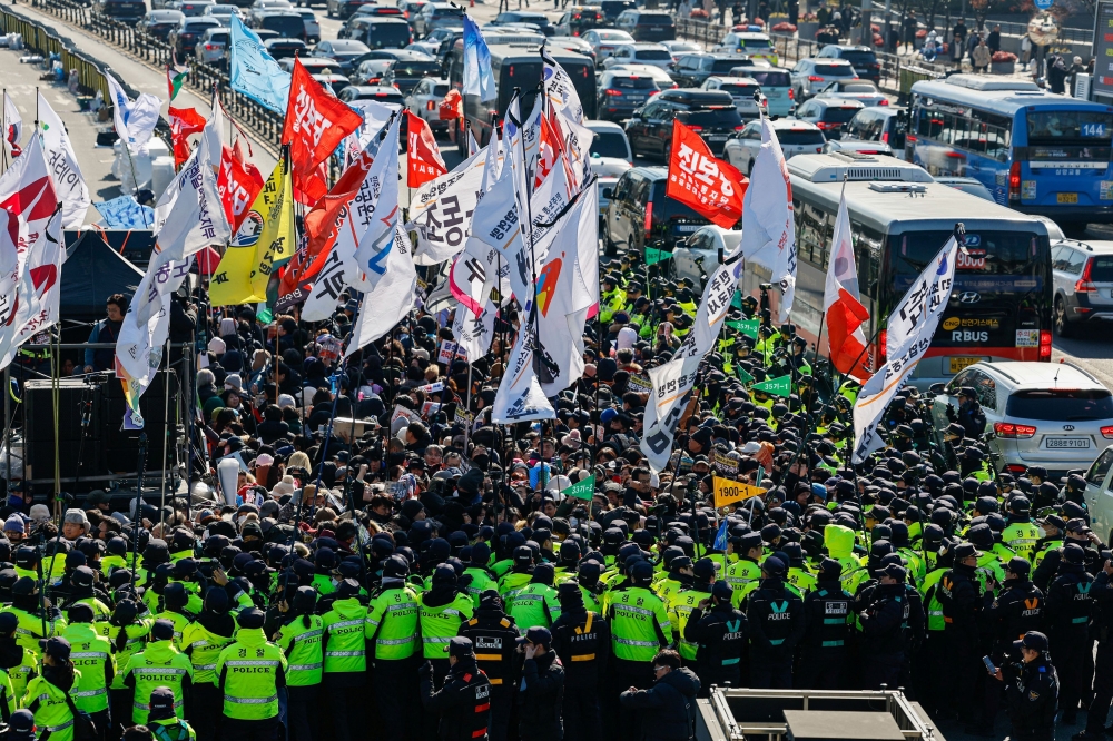 People take part in a protest against the impeached South Korean President Yoon Suk Yeol near his official residence, in Seoul, South Korea, January 4, 2025. — Reuters pic