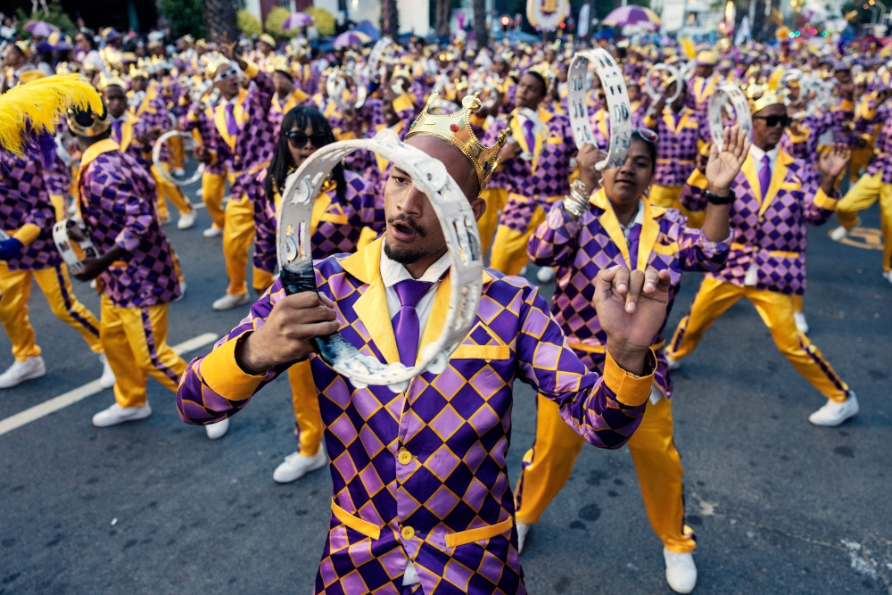 Kaapse Klopse minstrels dance as their troupe moves forward during the annual Kaapse Klopse parade, also known as ‘Tweede Nuwe Jaar’ (second New Year), in Cape Town on January 4, 2025. Thousands of colourfully costumed minstrels paraded through Cape Town Saturday in an exuberant century-old carnival rooted in the South African city's history of slavery that drew large crowds of spectators. — AFP pic