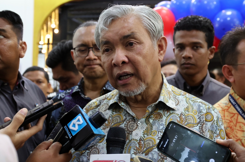 Deputy Prime Minister and Minister of Rural and Regional Development, Datuk Seri Dr Ahmad Zahid Hamidi, speaking to reporters after officiating the opening of Kuali Cafe@UKM at the Pusanika Building, Universiti Kebangsaan Malaysia (UKM), here today. — Bernama pic