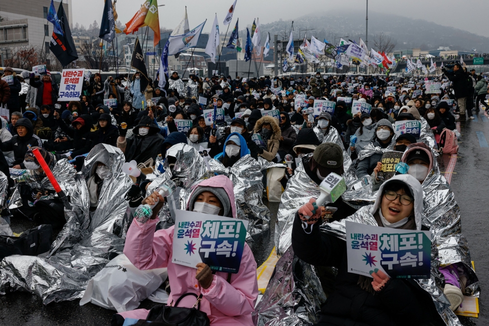 People take part in a protest against the impeached South Korean President Yoon Suk Yeol near his official residence in Seoul January 5, 2025. — Reuters pic  
