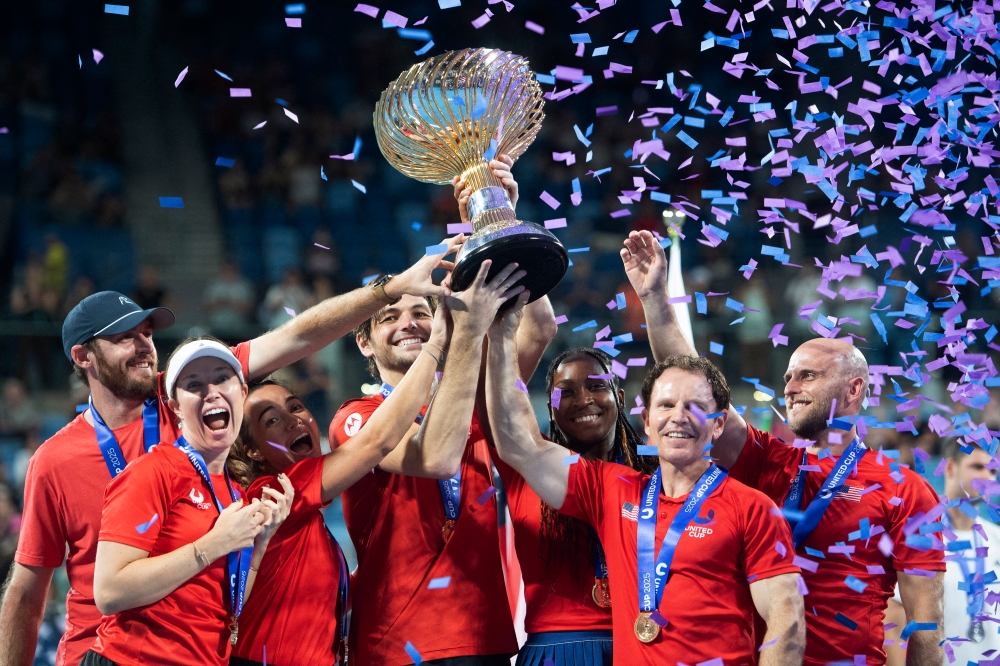 United States captain Michael Russell is seen with Taylor Fritz, Coco Gauff and teammates as they celebrate with the trophy on the podium after winning the final against Poland at the Ken Rosewall Arena, Sydney January 4, 2025. — Reuters pic  