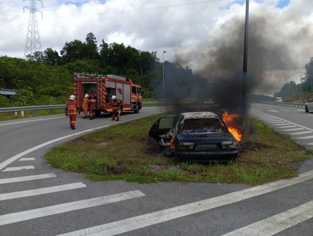 Man and young boy rescued before car engulfed in flames after crash on ...