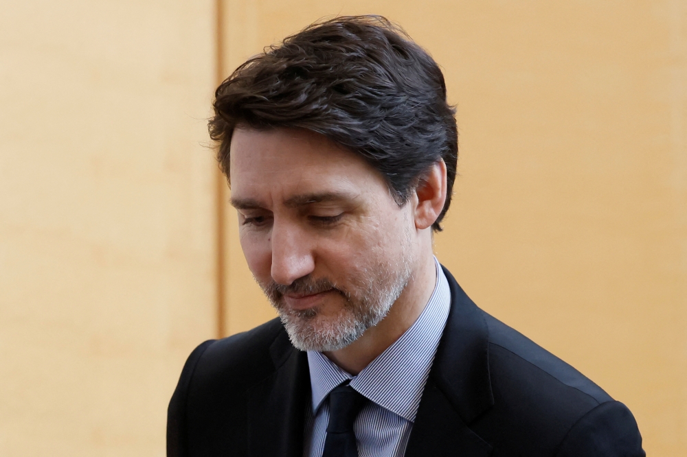 Canada's Prime Minister Justin Trudeau stands to leave after signing a book of condolences marking the passing of former US President Jimmy Carter in Ottawa, Ontario, Canada January 3, 2025. — Reuters piic