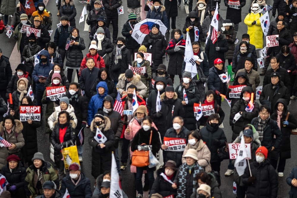 Supporters of impeached South Korean president Yoon Suk Yeol take part in a rally near his residence in Seoul. — AFP