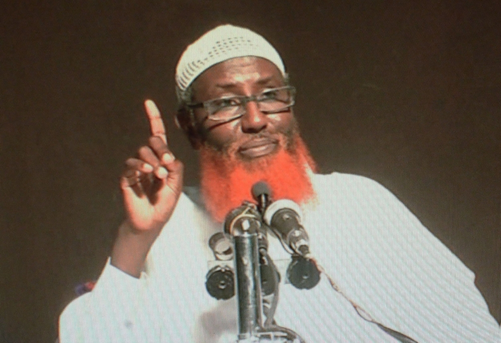 Abdul Qadir Mumin, identifiable by his glasses and bright orange, henna-dyed beard, is said to be presiding over the organisation's General Directory of Provinces from Somalia. — AFP pic