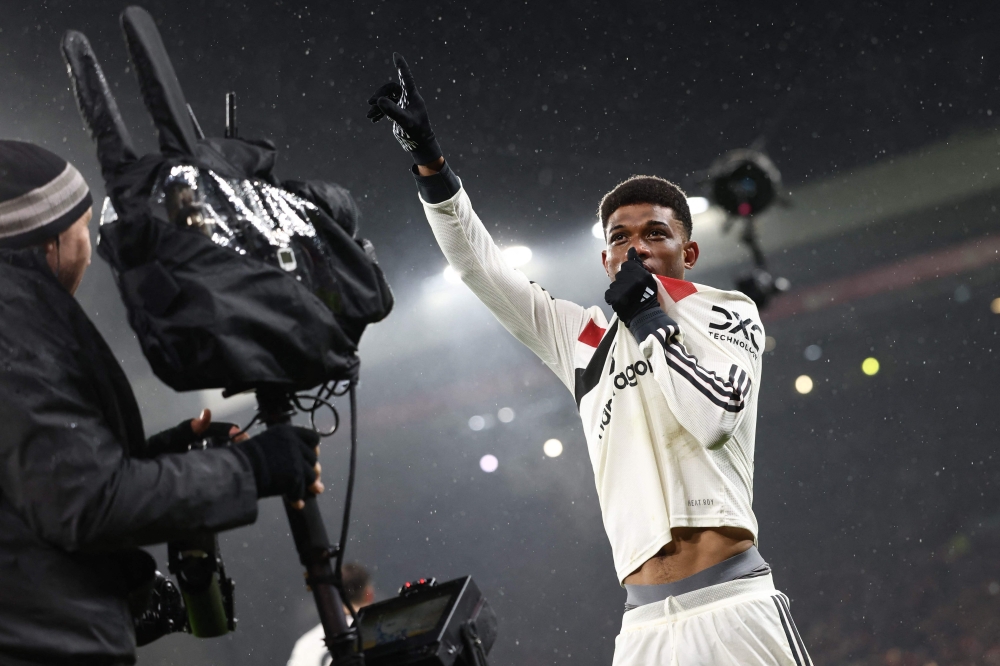 Manchester United's Ivorian midfielder Amad Diallo celebrates after scoring their second goal during the English Premier League football match between Liverpool and Manchester United at Anfield in Liverpool, north west England on January 5, 2025. — AFP pic