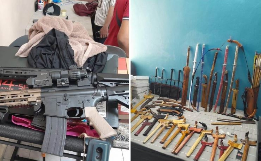 Two imitation machine guns were among the items seized by police during a raid on a terrace house used for processing ketum water in Lintang Bayan near Bayan Lepas here today. — Bernama pic/PDRM