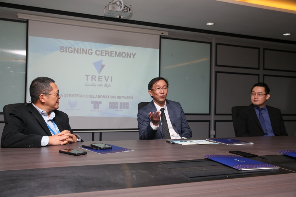 (L-R) Ancom Nylex CFO Lim Chang Meng, Trevi Properties managing director Felix Tan, and Trevi Properties general manager Dave Ley speak during a signing ceremony at Ancom Nylex Bhd. Jan 7, 2025. — Picture by Choo Choy May .