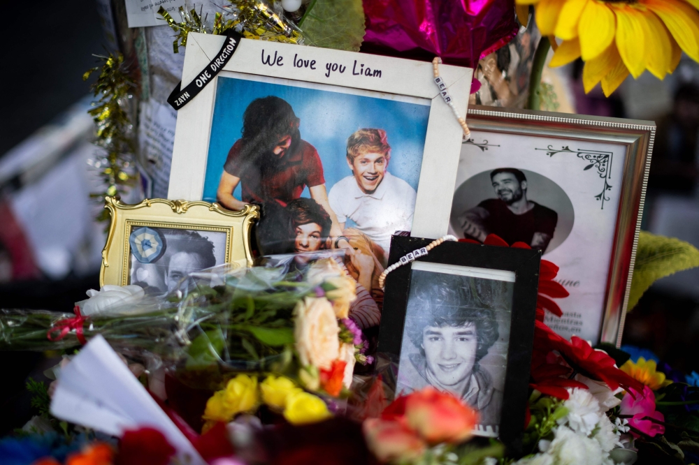 Offerings in honour of British singer Liam Payne are pictured in front of the Casa Sur Palermo hotel, where he died, in Buenos Aires on December 30, 2024. — AFP pic 