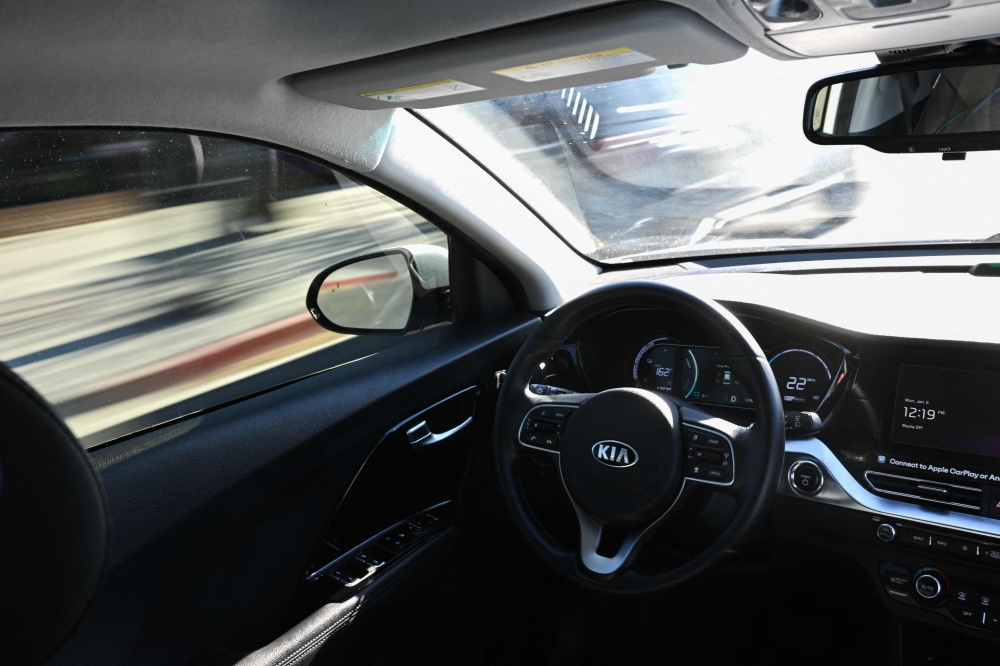A Kia Vay remote-drive electric vehicle cruises during a live demonstration of remote driving on city streets ahead of the Consumer Electronics Show (CES) in Las Vegas, Nevada, on January 6, 2025. — AFP pic