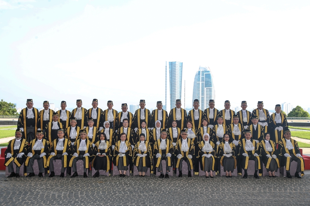 Chief Justice Tun Tengku Maimun Tuan Mat (centre) poses for a group pictures during the opening ceremony of the 2025 Legislative Year at the Putrajaya International Convention Centre (PICC) January 8, 2025. — Picture by Yusof Mat Isa