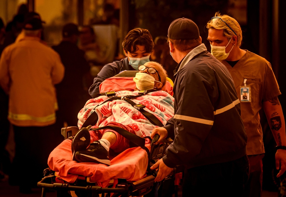 At least five people are now known to have died in wildfires raging around Los Angeles, with more deaths feared. — AFP