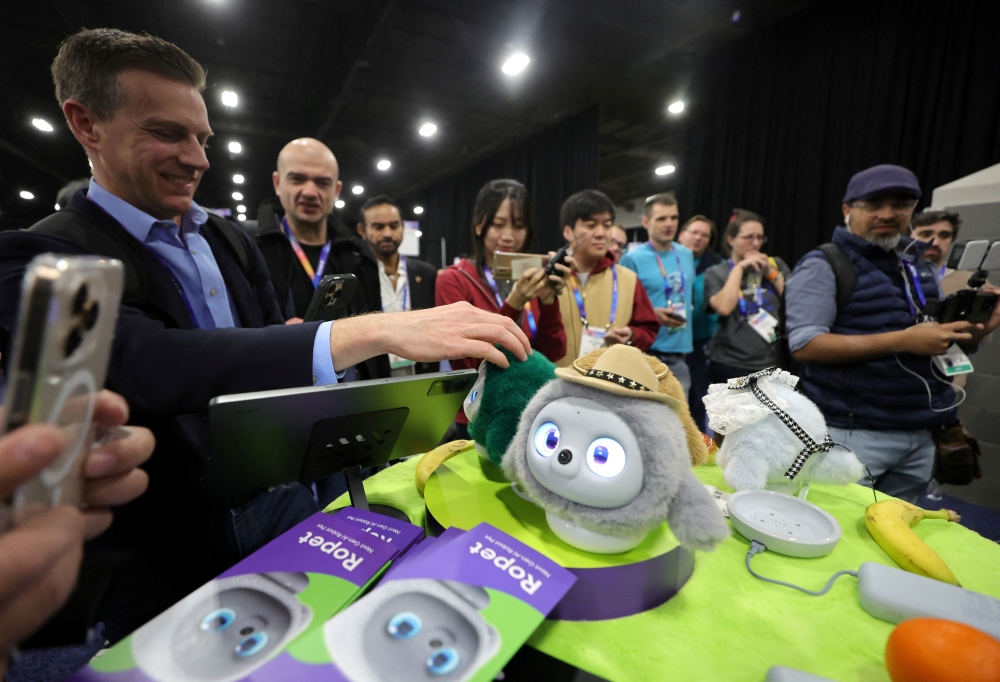 People look at Ropets, AI robot pets, during CES Unveiled at CES 2025, an annual consumer electronics trade show, in Las Vegas, Nevada, US January 5, 2025.  — Reuters pic