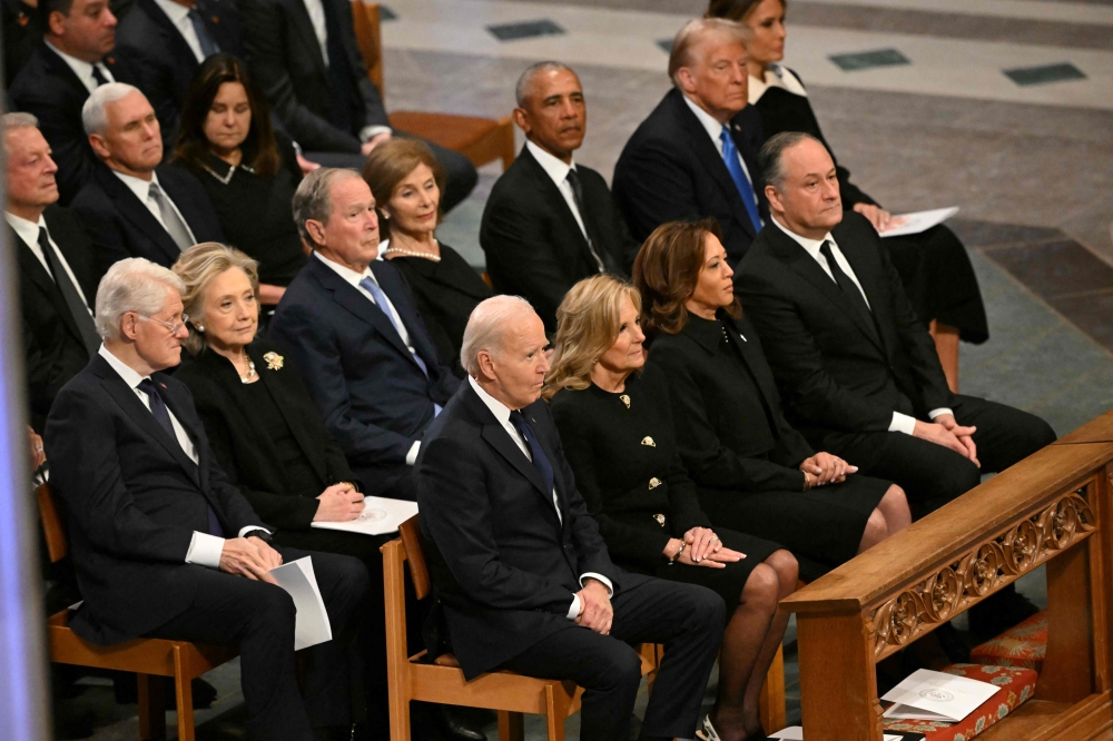 From left to right (front row) US President Joe Biden, First Lady Lady Jill Biden, Vice President Kamala Harris, Second Gentleman Doug Emhoff, (second row) former President Bill Clinton, former Secretary of State Hillary Clinton, former President George W. Bush, his wife Laura Bush, former President Barack Obama, President-elect Donald Trump and his wife Melania Trump attend the State Funeral Service for former US President Jimmy Carter. — AFP