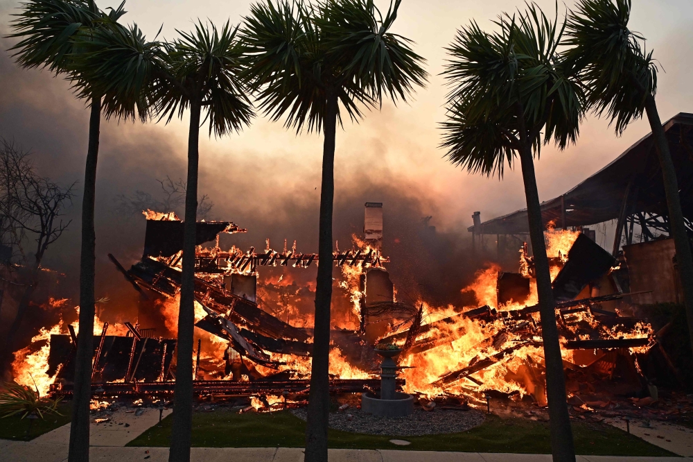 A home burns during the Palisades Fire in Pacific Palisades. — AFP pic