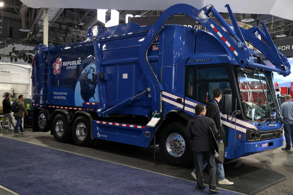Spectators walk past an Electric Refuse Collection Vehicle at the Oshkosh booth at the Consumer Electronics Show (CES) on January 7, 2025 in Las Vegas. — AFP pic