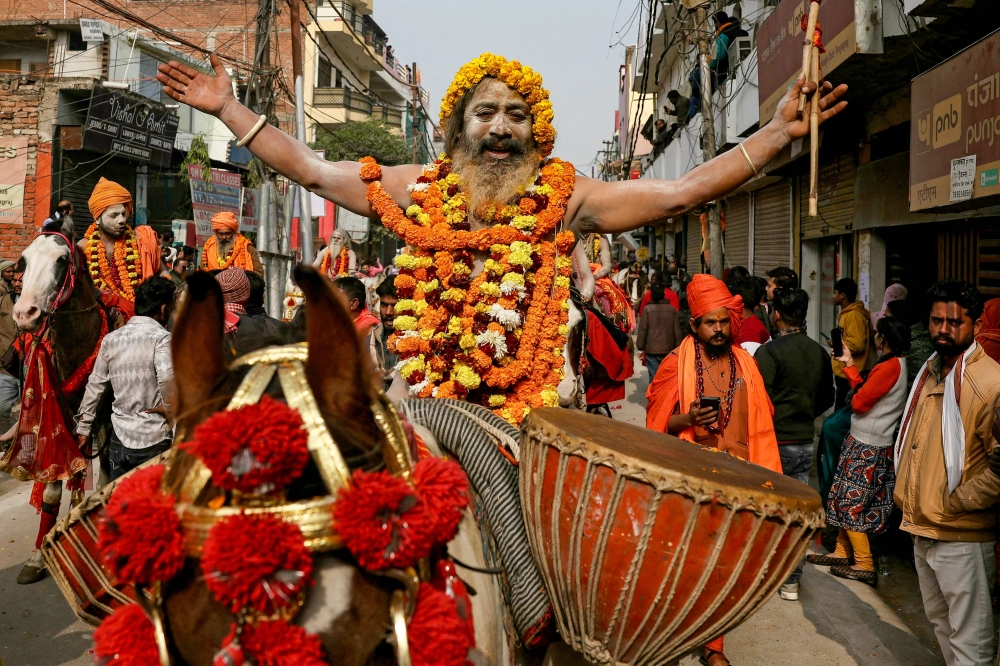 A Sadhu or Hindu holy man gestures during a religious procession of the Niranjani Akhara, ahead of the Maha Kumbh Mela festival in Prayagraj on January 4, 2025. — AFP pic