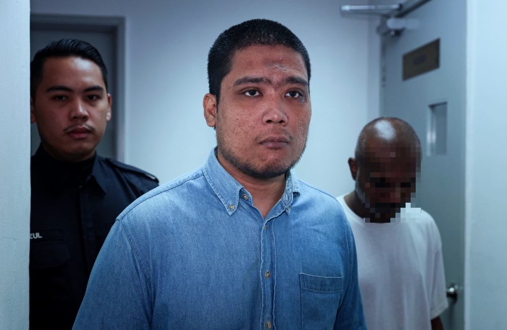 Muhammad Firdaus Zohare is brought for his hearing at the Ipoh Sessions Court January 10, 2025. — Bernama pic