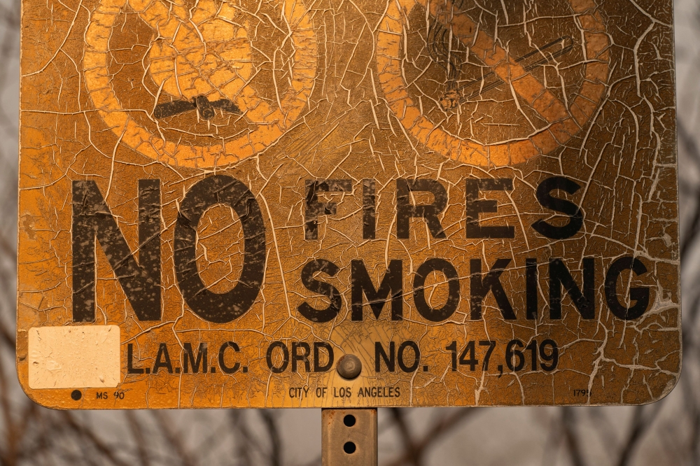 A burned sign sits following the Palisades Fire in the Pacific Palisades neighbourhood in Los Angeles, California, US on January 10, 2025. — Reuters pic