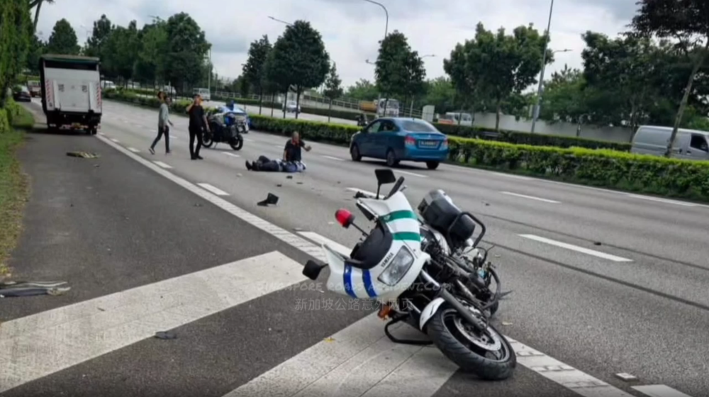 Screencap from Singapore Road Accident posted on Reddit/Singaporehappenings showing LTA enforcement officer Zdulfika Ahakasah on the ground after crashing from chasing a teen motorcyclist who refused to stop after being signalled to do so on June 4, 2024. 