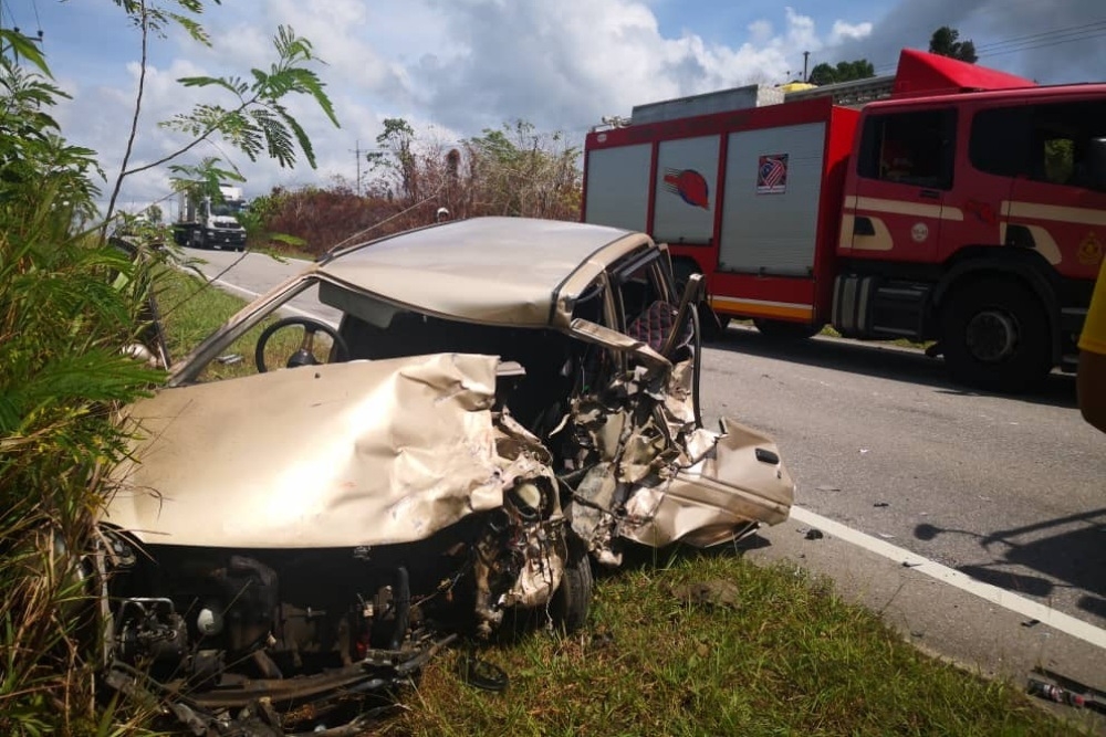 The wrecked Perodua Kancil is seen after a collision at Jalan Miri-Bintulu. — Picture courtesy of the Fire and Rescue Department 