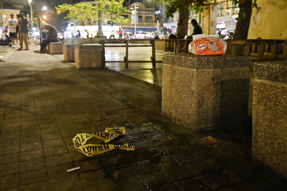 Police tape is pictured where a Cambodian MP was reportedly shot, in Bangkok on January 7, 2025. — AFP pic