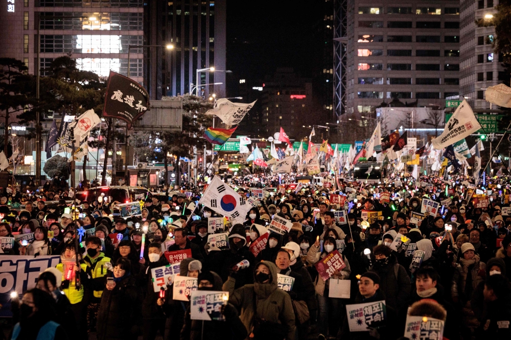 Protesters taking part in a demonstration against impeached South Korean president Yoon Suk Yeol. — AFP