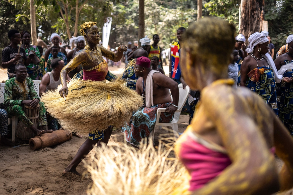 A Kokou initiate, a warrior god in the traditional religion of Benin, dances in the sacred forest in Ouidah, on January 9, 2025 during the first day of the Voodoo Festival. — AFP pic