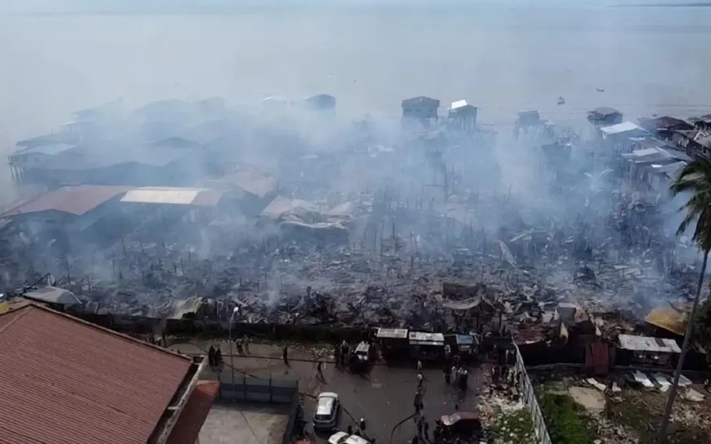 A total of 62 houses and a mosque were destroyed in a fire which broke out at a water village in Kampung Sri Aman 2, Tawau today. — Picture courtesy of the Fire and Rescue Department 
