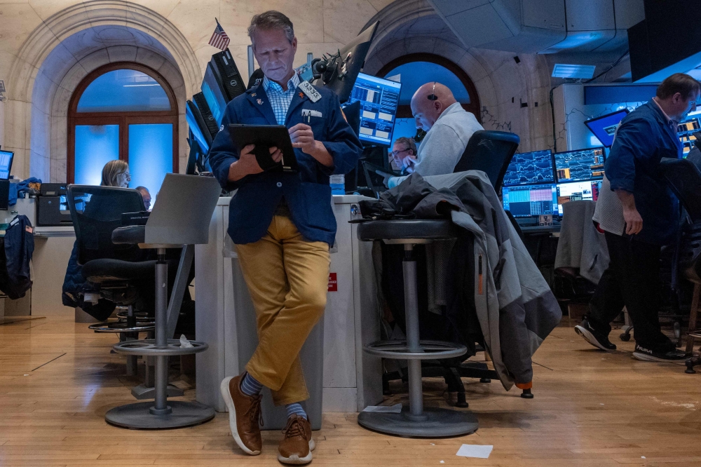 Traders work on the floor of the New York Stock Exchange (NYSE) on January 10, 2025 in New York City.  — AFP pic
