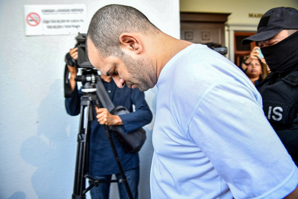 Israeli national Avitan Shalom is charged with possessing a box of Shell Shock NAS3 9mm containing eight bullets, three boxes of Bullet Master Co Ltd containing 150 bullets and 42 bullets in three different weapons without a license or weapons permit. — Bernama pic