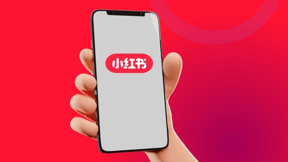 American creators are fleeing to another Chinese app, Xiaohongshu or Red Note in English as TikTok faces an imminent shutdown in the US. — Illustration by Erna Mahyuni