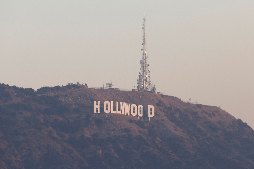 The Hollywood sign is shrouded in smoke from an overnight blaze in the Hollywood Hills, while a pair of massive wildfires menacing Los Angeles from the east and west were still burning uncontained, in Los Angeles, January 9, 2025. — Reuters pic 