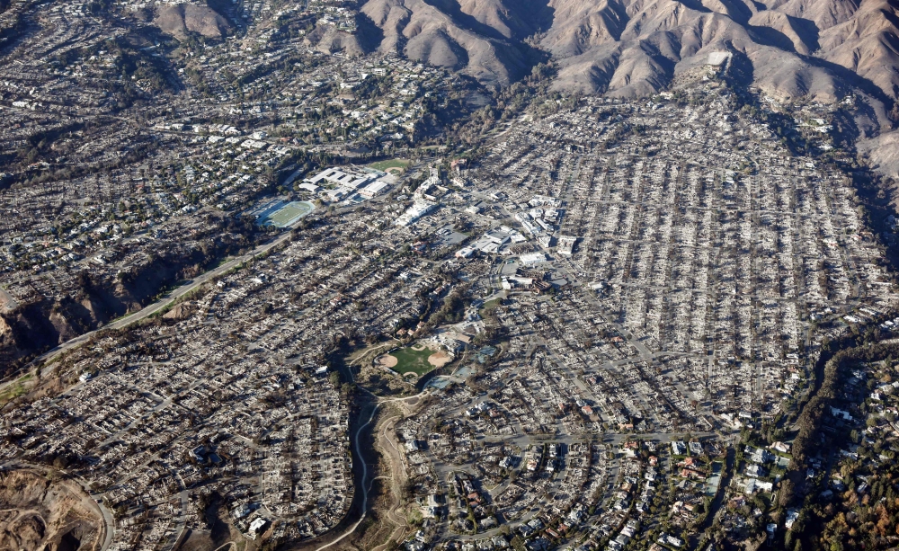 An aerial view of homes destroyed in the Palisades. Over 12,000 structures have been destroyed or damaged, while more than 35,000 acres have burned. — AFP
