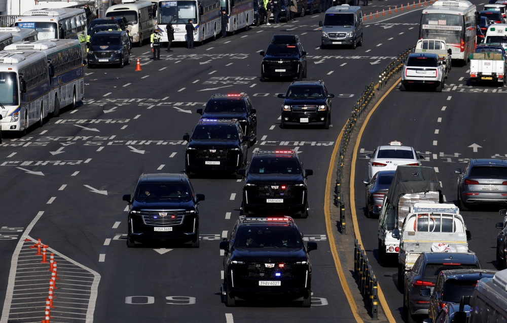 A motorcade believed to be carrying impeached South Korean President Yoon Suk-yeol following his arrest drives down a road, in Seoul January 15, 2025. — Reuters pic
