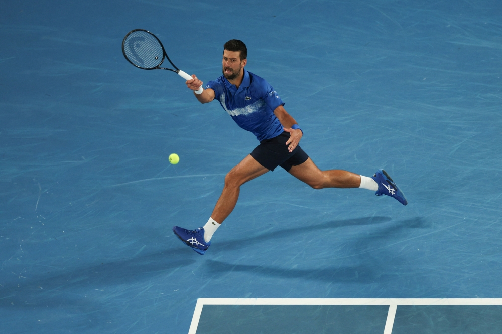 Serbia’s Novak Djokovic hits a return against Portugal’s Jaime Faria during their men’s singles match on day four of the Australian Open in Melbourne January 15, 2025. — AFP pic