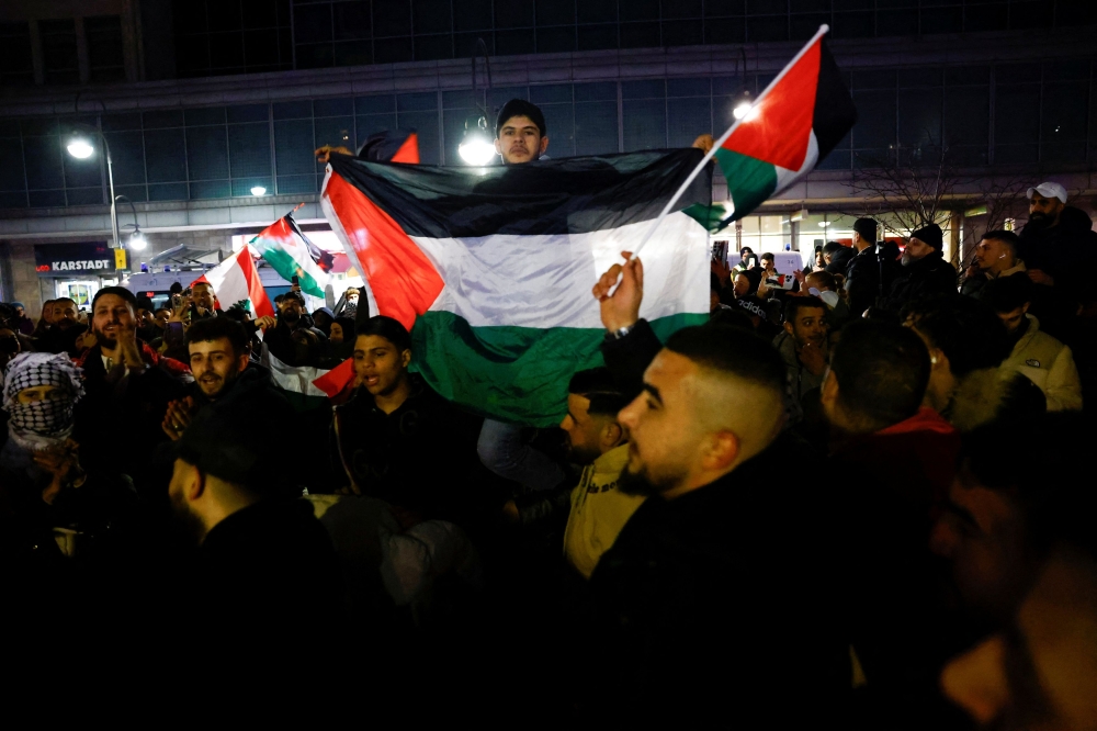 Palestinian supporters celebrate news of a ceasefire with Israel in Berlin January 15, 2025. — Reuters pic