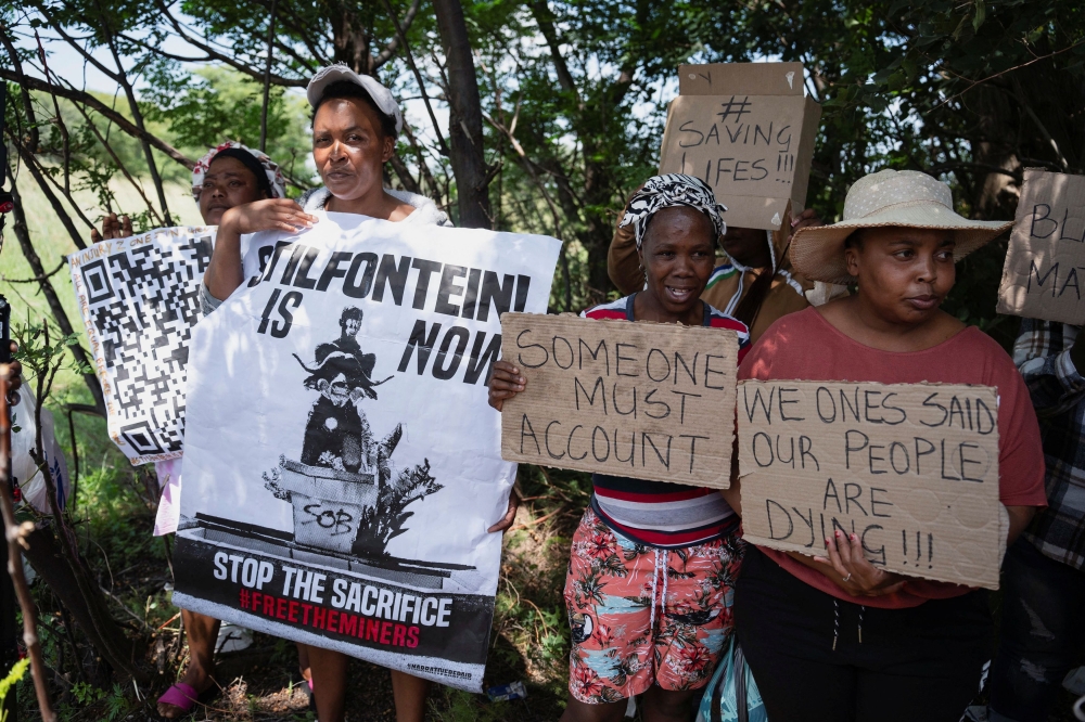 Community members hold a picket at the mine shaft where rescue operations are ongoing as attempts are made to rescue illegal miners who have been underground for months in Stilfontein, South Africa, January 14, 2025. — Reuters pic