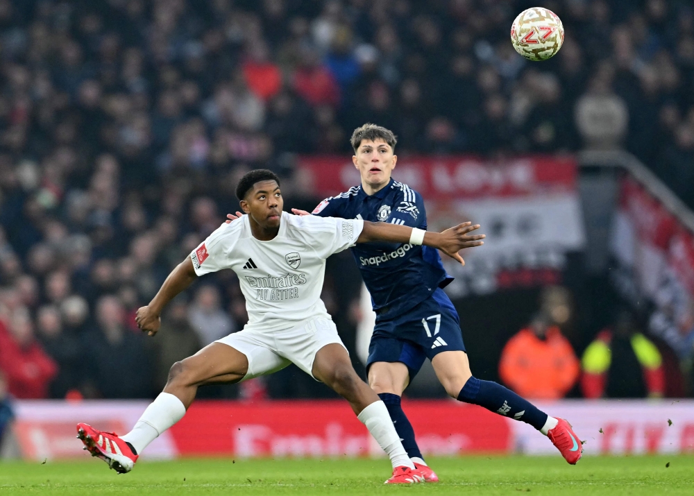 Arsenal’s Myles Lewis-Skelly vies with Manchester United’s Alejandro Garnacho during the English FA Cup third round match at the Emirates Stadium in London January 12, 2025. — AFP pic